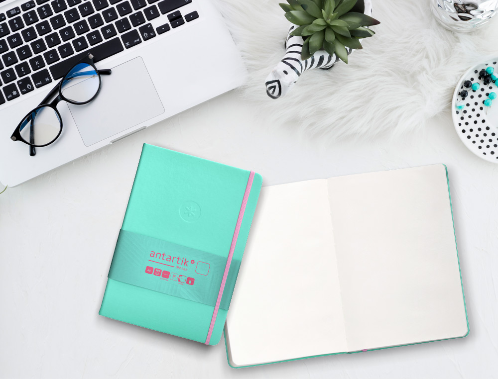 CUADERNO CON GOMILLA ANTARTIK NOTES TAPA DURA A5 HOJAS LISAS ROSA Y TURQUESA 100 HOJAS 80 GR FSC